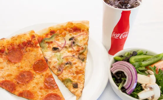 2 pizza slices, soda and a side salad